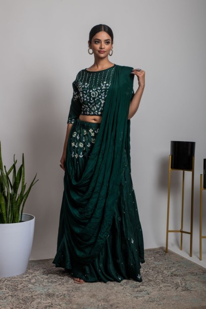 Dark Green color heavy blouse with matching skirt and Drape Style Dupatta