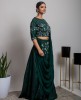 Dark Green color heavy blouse with matching skirt and Drape Style Dupatta