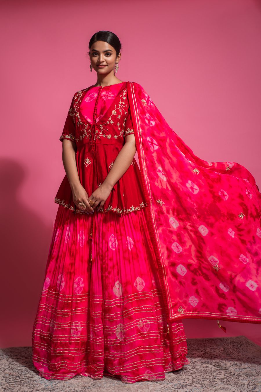 Peplum style Blouse with elegant Skirt and Dupatta in Dark Pink color