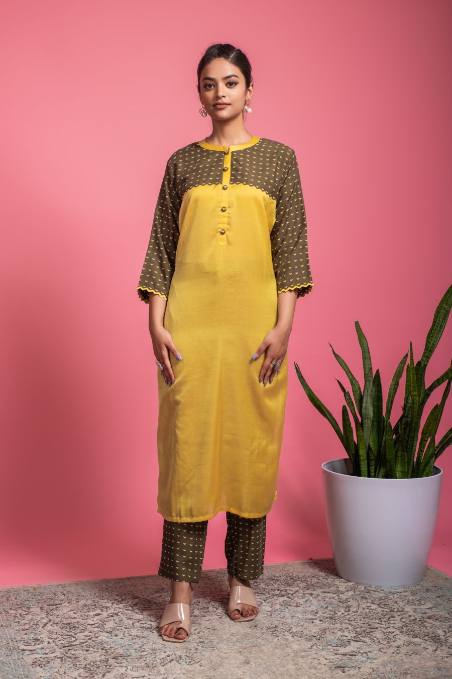 Yellow simple Kurti with Mehndi Brown Pants.